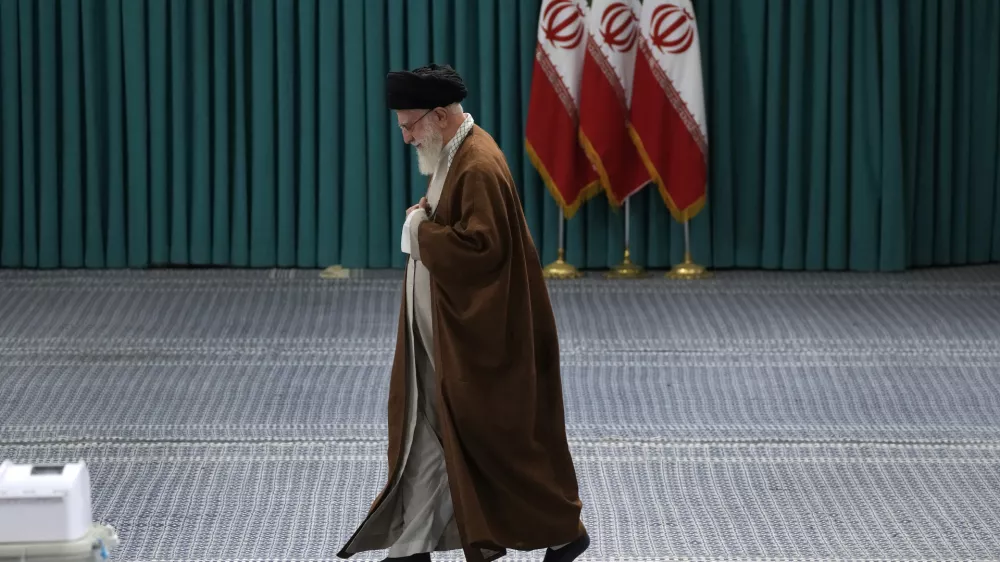 FILE - Iranian Supreme Leader Ayatollah Ali Khamenei arrives to vote for the parliamentary runoff elections, in Tehran, Iran, Friday, May 10, 2024. (AP Photo/Vahid Salemi, File)