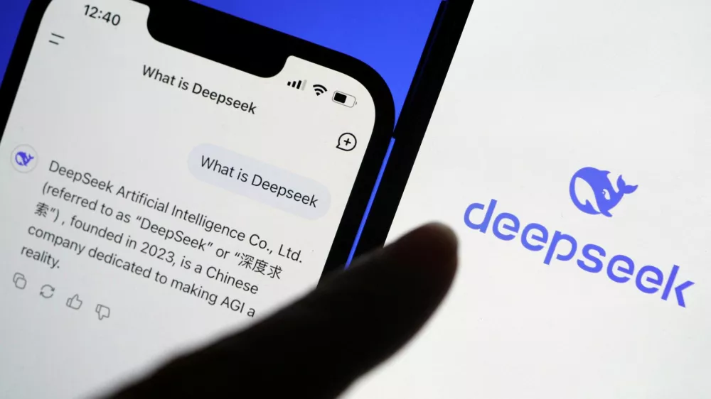 FILE PHOTO: The logo of DeepSeek is displayed alongside its AI assistant app on a mobile phone, in this illustration picture taken January 28, 2025. REUTERS/Florence Lo/Illustration/File Photo