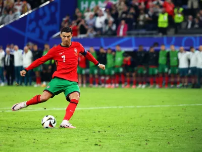 FILED - 05 July 2024, Hamburg: Portugal's Cristiano Ronaldo shoots his penalty during the UEFA EURO 2024 quarter-final soccer match between Portugal and France at the Volksparkstadion Hamburg. Photo: Jens Büttner/dpa