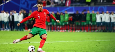 FILED - 05 July 2024, Hamburg: Portugal's Cristiano Ronaldo shoots his penalty during the UEFA EURO 2024 quarter-final soccer match between Portugal and France at the Volksparkstadion Hamburg. Photo: Jens Büttner/dpa