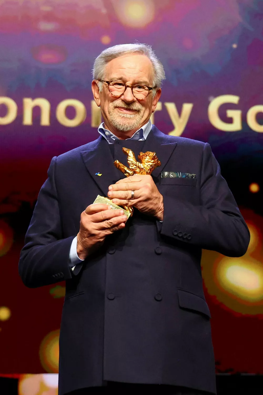 Director Steven Spielberg poses with the Honorary Golden Bear Award for Lifetime Achievement which he received at the 73rd Berlinale International Film Festival in Berlin, Germany, February 21, 2023. REUTERS/Fabrizio Bensch