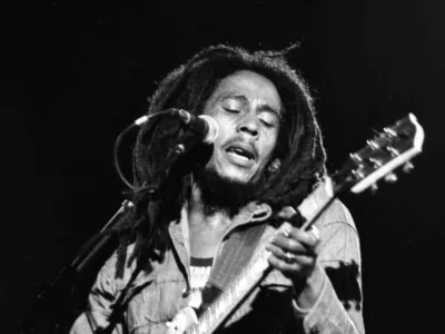 FILE - In this July 4, 1980 file photo, Jamaican Reggae singer Bob Marley performs in front of an audience of 40,000 during a concert in Paris. The Bob Marley documentary "Marley" will stream on Facebook simultaneously during its theatrical opening, a signal that social media may also play a role in shifting movie release windows. (AP File Photo)