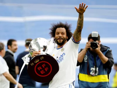 FILE PHOTO: Soccer Football - LaLiga - Real Madrid v Espanyol - Santiago Bernabeu, Madrid, Spain - April 30, 2022 Real Madrid's Marcelo holds the trophy and celebrates after winning LaLiga REUTERS/Juan Medina/File Photo