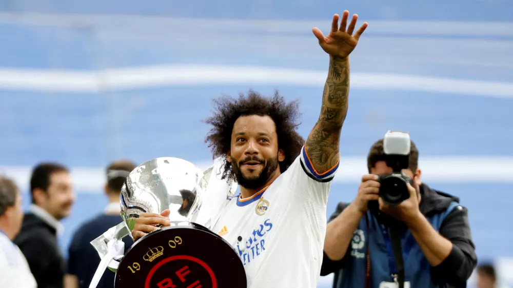 FILE PHOTO: Soccer Football - LaLiga - Real Madrid v Espanyol - Santiago Bernabeu, Madrid, Spain - April 30, 2022 Real Madrid's Marcelo holds the trophy and celebrates after winning LaLiga REUTERS/Juan Medina/File Photo