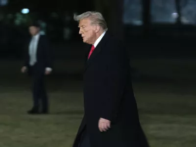 President Donald Trump arrives on the South Lawn of the White House, in Washington, Monday, Feb. 10, 2025. (AP Photo/Jose Luis Magana)