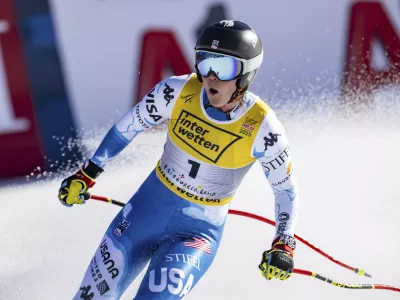 United States' Breezy Johnson celebrates at the finish area of a women's downhill race, at the Alpine Ski World Championships, in Saalbach-Hinterglemm, Austria, Saturday, Feb. 8, 2025. (Jean-Christophe Bott/Keystone via AP)