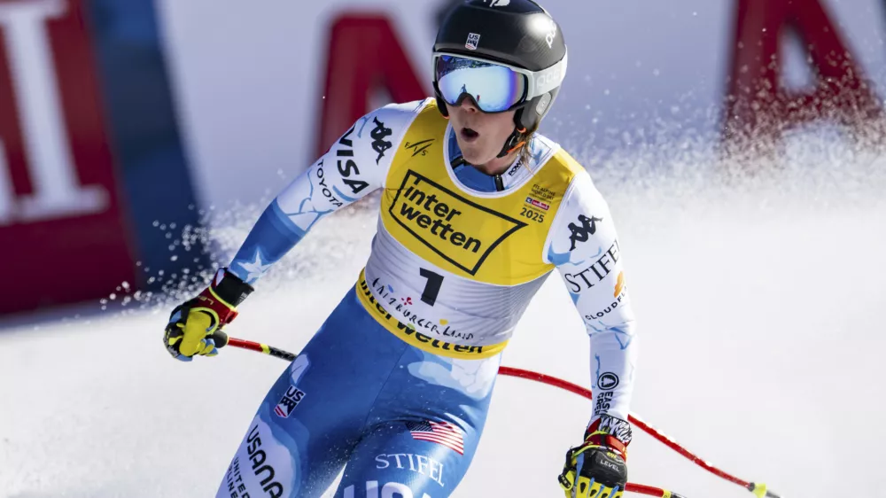 United States' Breezy Johnson celebrates at the finish area of a women's downhill race, at the Alpine Ski World Championships, in Saalbach-Hinterglemm, Austria, Saturday, Feb. 8, 2025. (Jean-Christophe Bott/Keystone via AP)