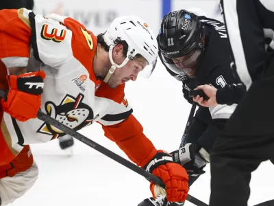 Feb 8, 2025; Los Angeles, California, USA; Los Angeles Kings center Anze Kopitar (11) prepares for a face off against Anaheim Ducks center Mason McTavish (23) during the second period of a hockey game at Crypto.com Arena. Mandatory Credit: Jessica Alcheh-Imagn Images