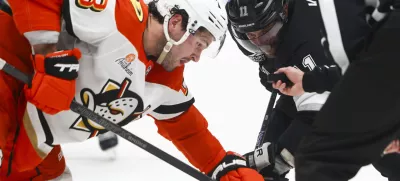 Feb 8, 2025; Los Angeles, California, USA; Los Angeles Kings center Anze Kopitar (11) prepares for a face off against Anaheim Ducks center Mason McTavish (23) during the second period of a hockey game at Crypto.com Arena. Mandatory Credit: Jessica Alcheh-Imagn Images