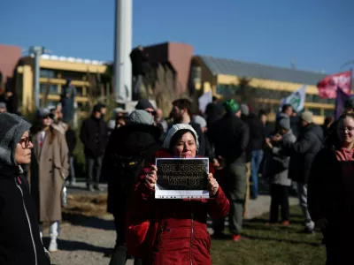 A woman holds a poster as she attends a protest over the fatal November 2024 Novi Sad railway station roof collapse, in Belgrade, Serbia, February 8, 2025. REUTERS/Stoyan Nenov