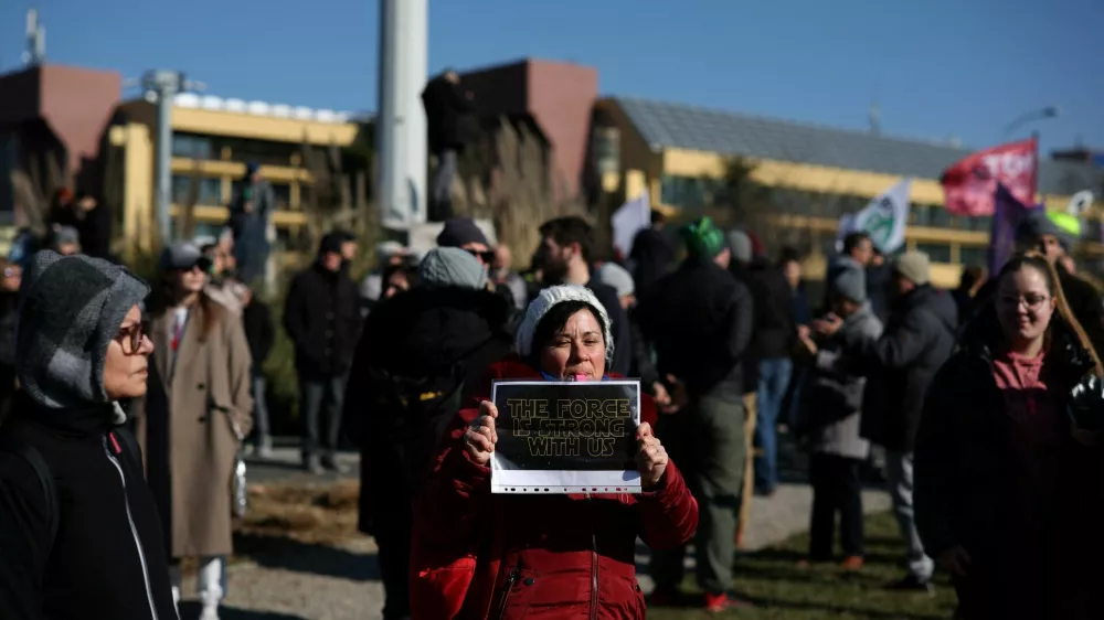 A woman holds a poster as she attends a protest over the fatal November 2024 Novi Sad railway station roof collapse, in Belgrade, Serbia, February 8, 2025. REUTERS/Stoyan Nenov