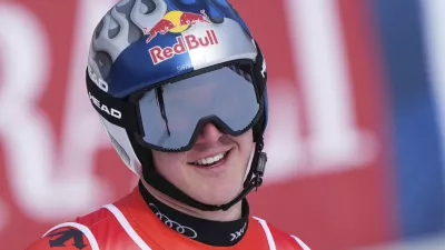 Switzerland's Franjo von Allmen celebrates at the finish area of a men's downhill race, at the Alpine Ski World Championships, in Saalbach-Hinterglemm, Austria, Sunday, Feb. 9, 2025. (AP Photo/Giovanni Auletta)