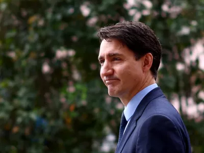 Canada's Prime Minister Justin Trudeau reacts at the Ismaili Centre Lisbon on the day of the funeral of Prince Karim Al-Hussaini Aga Khan IV, the spiritual leader of Ismaili Muslims, in Lisbon, Portugal, February 8, 2025. REUTERS/Pedro Nunes