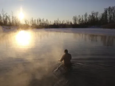 A man bathes in water during a traditional Epiphany celebration as the temperature dropped to about -12 degrees (10,4 degrees Fahrenheit) near the Achairsky monastery outside the Siberian city of Omsk, Russia, early Thursday, Jan. 19, 2023. Across Russia, the devout and the daring are observing the Orthodox Christian feast day of Epiphany by immersing themselves in frigid water through holes cut through the ice of lakes and rivers. Epiphany celebrates the revelation of Jesus Christ as the incarnation of God through his baptism in the River Jordan. (AP Photo/Evgeniy Sofiychuk)