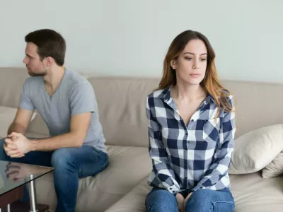 PP2TRE Angry couple sitting separately on couch ignoring each other