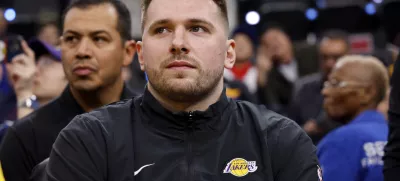 Los Angeles Lakers guard Luka Doncic sits on the bench before an NBA basketball game against the Los Angeles Clippers, Tuesday, Feb. 4, 2025, in Inglewood, Calif. (AP Photo/Kevork Djansezian)