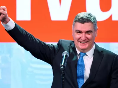 Croatian President and presidential candidate Zoran Milanovic gestures after the first unofficial results of the second round of the presidential election, at Zoran Milanovic's headquarters in Zagreb, Croatia, January 12, 2025. REUTERS/Antonio Bronic