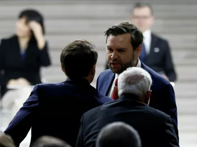 U.S. Vice President JD Vance greets French President Emmanuel Macron and Indian Prime Minister Narendra Modi after delivering a speech during the plenary session of the Artificial Intelligence (AI) Action Summit at the Grand Palais in Paris, France, February 11, 2025. REUTERS/Benoit Tessier