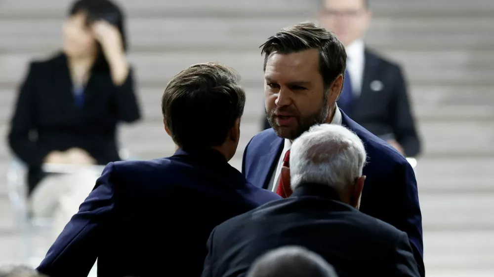 U.S. Vice President JD Vance greets French President Emmanuel Macron and Indian Prime Minister Narendra Modi after delivering a speech during the plenary session of the Artificial Intelligence (AI) Action Summit at the Grand Palais in Paris, France, February 11, 2025. REUTERS/Benoit Tessier