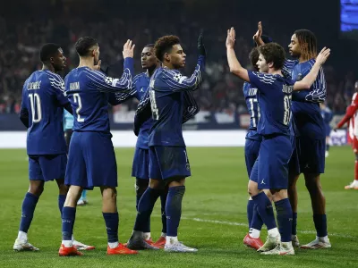 Soccer Football - Champions League - Knockout Phase Playoff - First Leg - Brest v Paris St Germain - Stade de Roudourou, Guingamp, France - February 11, 2025 Paris St Germain's Ousmane Dembele celebrates scoring their second goal with teammates REUTERS/Stephane Mahe