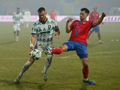 Soccer Football - Conference League - Knockout Phase Playoff - First Leg - Borac Banja Luka v Olimpija - Banja Luka City Stadium, Banja Luka, Bosnia and Herzegovina - February 13, 2025 Olimpija's Alex Matthias Tamm in action with Borac Banja Luka's Bart Meijers REUTERS/Amel Emric