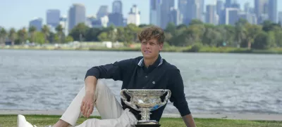 Jannik Sinner of Italy poses with Norman Brookes Challenge Cup the morning after defeating Alexander Zverev of Germany in the men's singles final at the Australian Open tennis championship in Melbourne, Australia, Monday, Jan. 27, 2025. (AP Photo/Mark Baker)