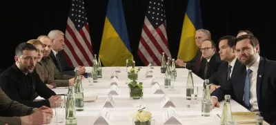 Ukraine's President Volodymyr Zelenskyy, left, and United States Vice-President JD Vance, right, pose during a meeting on the sidelines of the Munich Security Conference in Munich, Germany, Friday, Feb. 14, 2025. (AP Photo/Matthias Schrader)