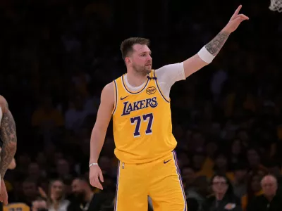 Feb 10, 2025; Los Angeles, California, USA; Los Angeles Lakers guard Luka Doncic (77) reacts after a basket against the Utah Jazz at Crypto.com Arena. Mandatory Credit: Jayne Kamin-Oncea-Imagn Images