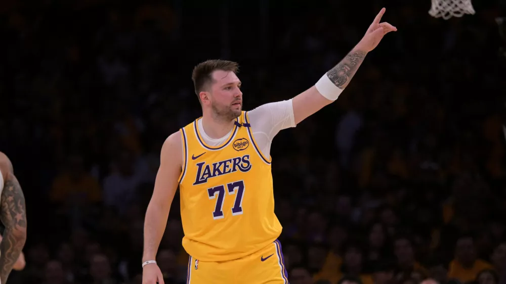 Feb 10, 2025; Los Angeles, California, USA; Los Angeles Lakers guard Luka Doncic (77) reacts after a basket against the Utah Jazz at Crypto.com Arena. Mandatory Credit: Jayne Kamin-Oncea-Imagn Images