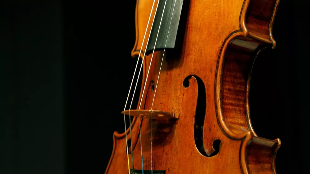 ﻿FILE PHOTO: A Stradivarius violin known as "The Penny" is displayed at Christie's auction house in New York March 27, 2008. REUTERS/Brendan McDermid (UNITED STATES)/File Photo