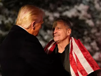 U.S. President Donald Trump greets released American schoolteacher Marc Fogel, who had been held in Russia since 2021, at the White House in Washington, D.C, U.S., February 11, 2025. REUTERS/Nathan Howard