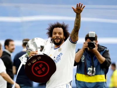 FILE PHOTO: Soccer Football - LaLiga - Real Madrid v Espanyol - Santiago Bernabeu, Madrid, Spain - April 30, 2022 Real Madrid's Marcelo holds the trophy and celebrates after winning LaLiga REUTERS/Juan Medina/File Photo