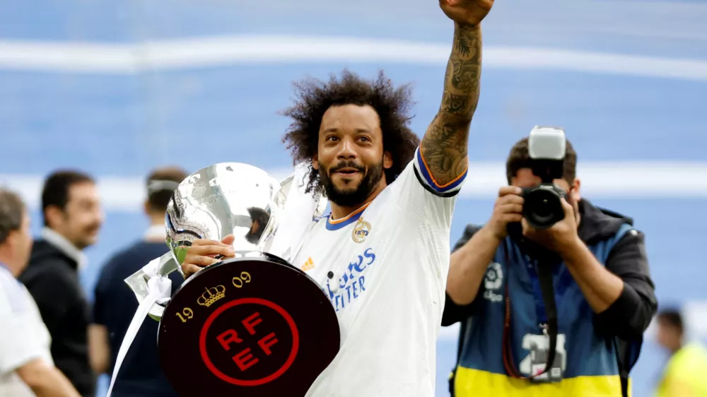 FILE PHOTO: Soccer Football - LaLiga - Real Madrid v Espanyol - Santiago Bernabeu, Madrid, Spain - April 30, 2022 Real Madrid's Marcelo holds the trophy and celebrates after winning LaLiga REUTERS/Juan Medina/File Photo