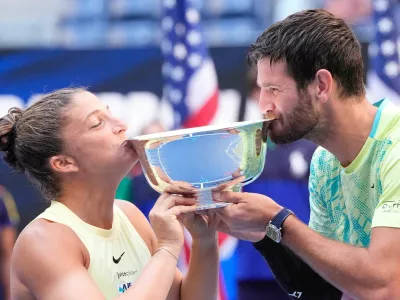 FILE PHOTO: Sept 5 2024; Flushing, NY, USA;  Sara Errani and Andrea Vavassori (ITA) with the US Open trophy after beating Donald Young and Taylor Townsend (USA) in the Mixed Doubles Final on day eleven of the 2024 U.S. Open tennis tournament at USTA Billie Jean King National Tennis Center. Mandatory Credit: Robert Deutsch-Imagn Images/File Photo