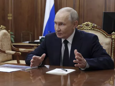 Russian President Vladimir Putin gestures while speaking to the head of the Russian-controlled Donetsk region of Ukraine Denis Pushilin, at the Kremlin in Moscow, Russia, Monday, Feb. 10, 2025. (Gavriil Grigorov, Sputnik, Kremlin Pool Photo via AP)