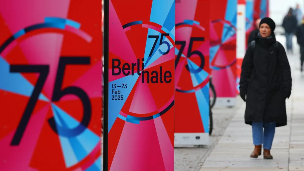 A pedestrian walks past advertising posters for the upcoming 75th Berlinale International Film Festival in Berlin, Germany February 12, 2025. REUTERS/Fabrizio Bensch