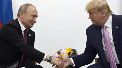 FILE - In this June 28, 2019, file photo, President Donald Trump, right, shakes hands with Russian President Vladimir Putin, left, during a bilateral meeting on the sidelines of the G-20 summit in Osaka, Japan. (AP Photo/Susan Walsh, File)