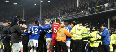 Liverpool and Everton players tussle following the final whistle in a Premier League soccer match at Goodison Park, Wednesday, Feb. 12, 2025, in Liverpool. (Nick Potts/PA via AP)