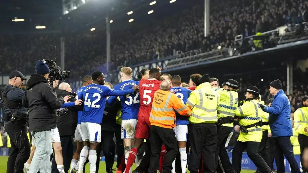 Liverpool and Everton players tussle following the final whistle in a Premier League soccer match at Goodison Park, Wednesday, Feb. 12, 2025, in Liverpool. (Nick Potts/PA via AP)