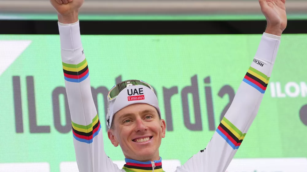 Reigning World Champion Slovenia's Tadej Pogacar celebrates winning Il Lombardia, Tour of Lombardy cycling race, in Como, Italy, Saturday, Oct. 12, 2024. (Spada/LaPresse via AP)