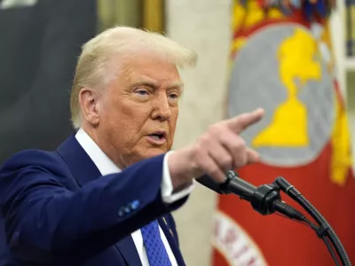 President Donald Trump speaks as Tulsi Gabbard is sworn in as the Director of National Intelligence in the Oval Office of the White House, Wednesday, Feb. 12, 2025, in Washington. (Photo/Alex Brandon)