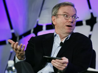 Google Executive Chairman Eric Schmidt, holding a cell phone running Google software speaks on a panel discussing "The Next Big Thing" on the opening day of the Consumer Electronics Show in Las Vegas January 10, 2012.  REUTERS/Rick Wilking (UNITED STATES - Tags: BUSINESS SCIENCE TECHNOLOGY)