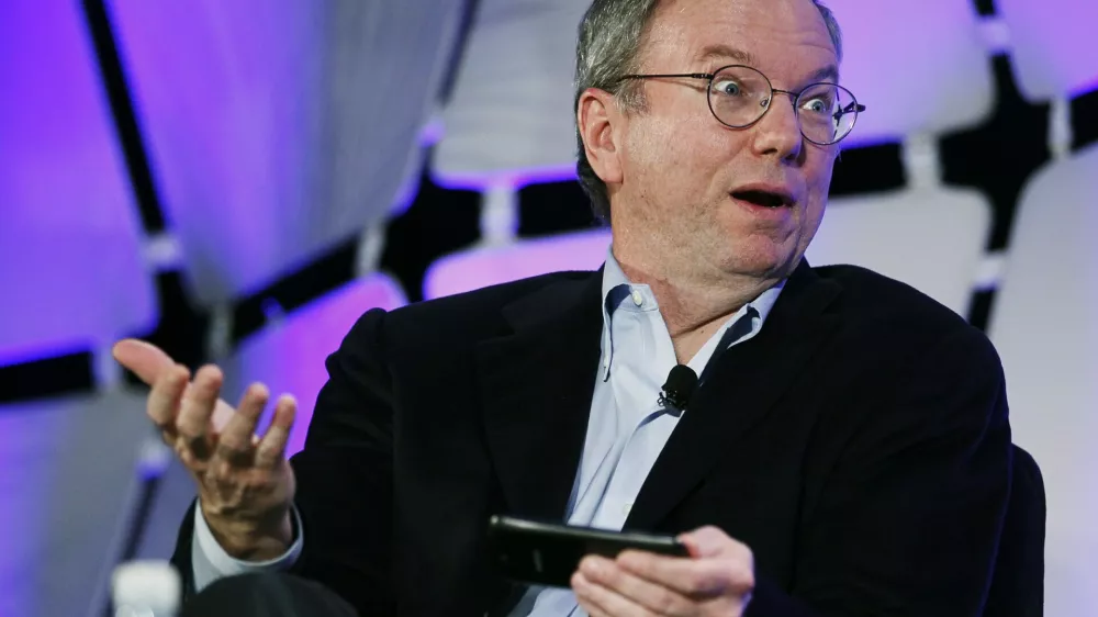 Google Executive Chairman Eric Schmidt, holding a cell phone running Google software speaks on a panel discussing "The Next Big Thing" on the opening day of the Consumer Electronics Show in Las Vegas January 10, 2012.  REUTERS/Rick Wilking (UNITED STATES - Tags: BUSINESS SCIENCE TECHNOLOGY)