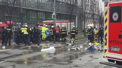 Emergency services attend the scene of an accident after a driver hit a group of people in Munich, Germany, Thursday Feb. 13, 2025. (Peter Kneffel/dpa via AP)