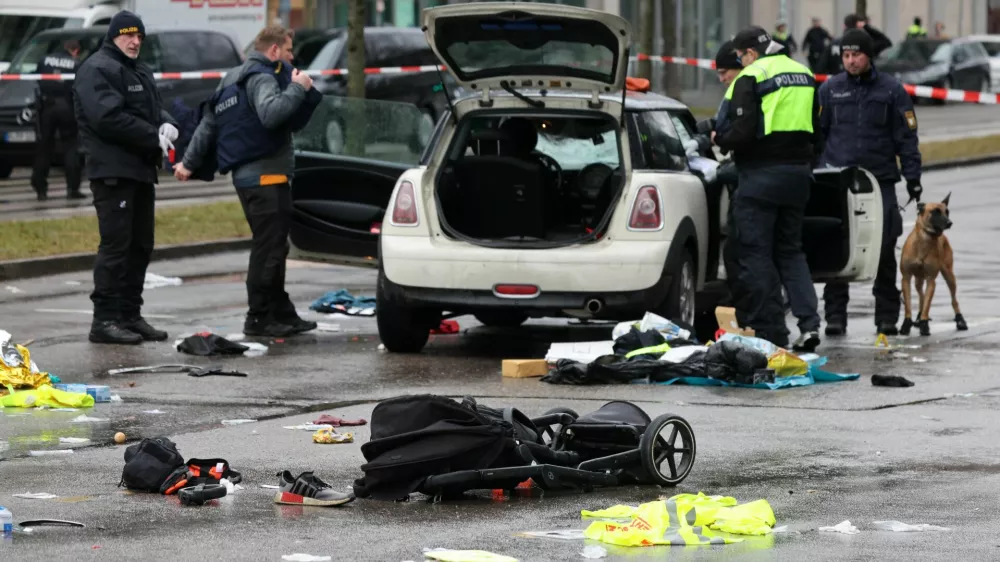 Police works at a car which drove into a crowd in Munich, Germany, February 13, 2025, injuring several people.  REUTERS/Wolfgang Rattay