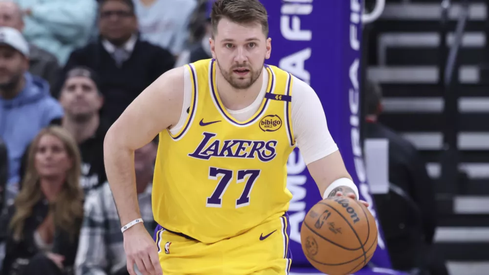 Los Angeles Lakers guard Luka Doncic brings the ball up the court against the Utah Jazz during the first half of an NBA basketball game, Wednesday, Feb. 12, 2025, in Salt Lake City. (AP Photo/Rob Gray)