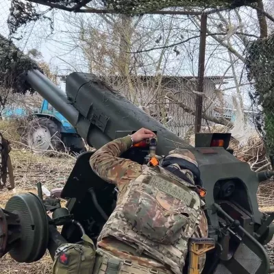 FILE - In this photo taken from a video released by Russian Defense Ministry press service on Nov. 29, 2024, a Russian serviceman aims a D-30 howitzer towards Ukrainian positions in the border area of Kursk region, Russia. (Russian Defense Ministry Press Service via AP, File)