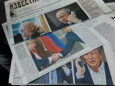 Daily newspapers with covers, dedicated to the recent phone call of Russian President Vladimir Putin and U.S. President Donald Trump, are laid out at a newsstand in a street in Moscow, Russia, February 13, 2025. REUTERS/Maxim Shemetov/Illustration