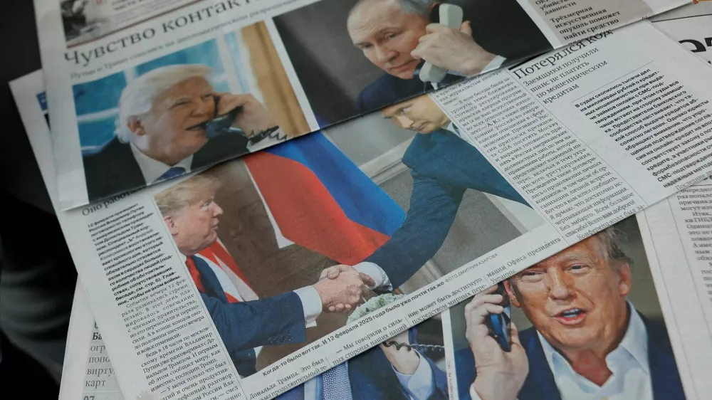 Daily newspapers with covers, dedicated to the recent phone call of Russian President Vladimir Putin and U.S. President Donald Trump, are laid out at a newsstand in a street in Moscow, Russia, February 13, 2025. REUTERS/Maxim Shemetov/Illustration