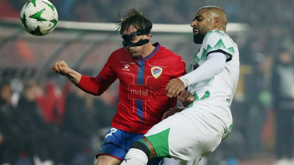 Soccer Football - Conference League - Knockout Phase Playoff - First Leg - Borac Banja Luka v Olimpija - Banja Luka City Stadium, Banja Luka, Bosnia and Herzegovina - February 13, 2025 Borac Banja Luka's Enver Kulasin in action with Olimpija's David Sualehe REUTERS/Amel Emric